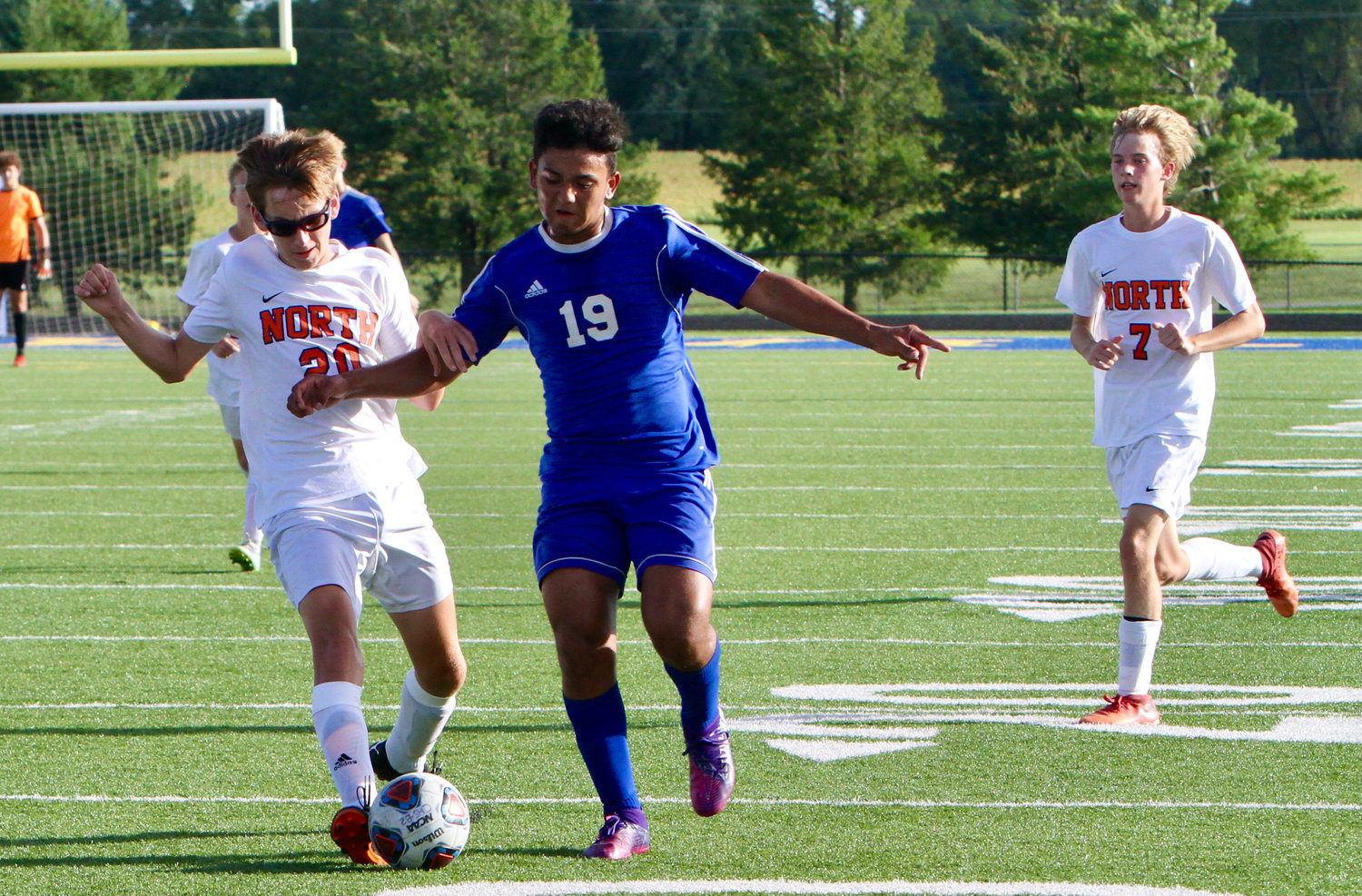 Crawfordsville's Kevin Puerto and North Montgomery's Nathan Woosley battle for possession.